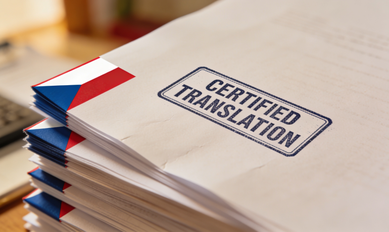 A stack of documents with a Czech flag and a certified translation stamp on them.